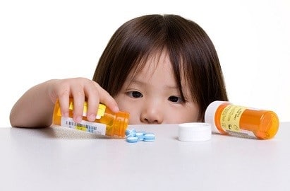 kid playing medicine pill
